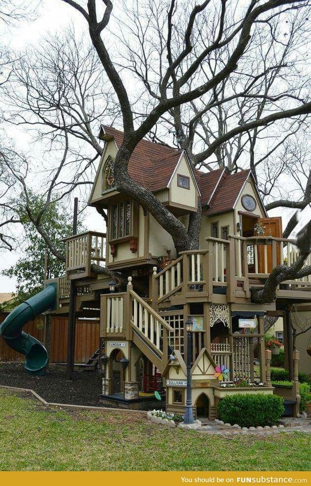 Describe this backyard treehouse in one word